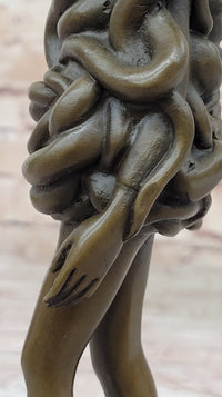 Bronze Sculpture of Woman Wearing Snakes - Unwavering by Pascal Delor
