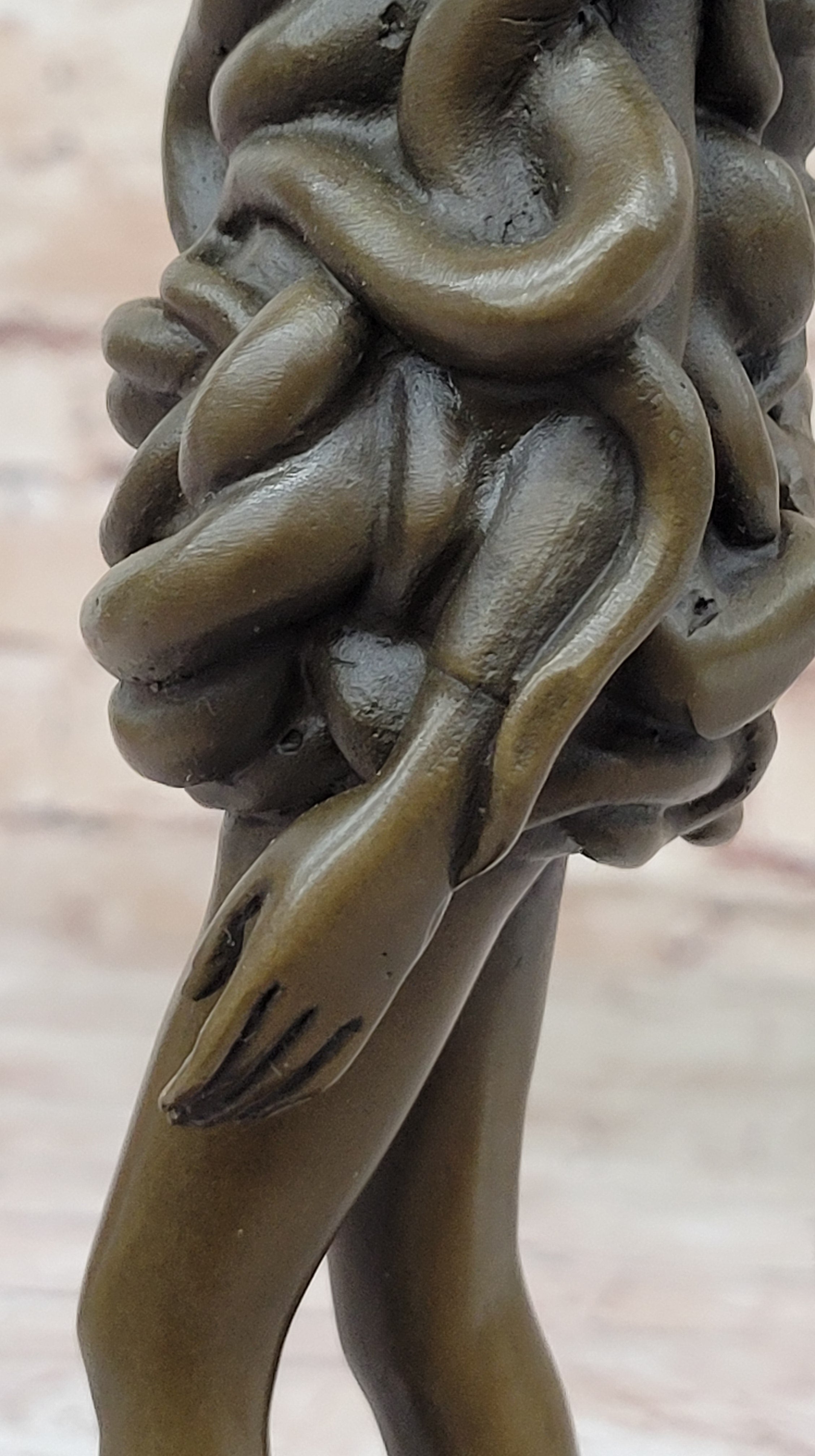 Bronze Sculpture of Woman Wearing Snakes - Unwavering by Pascal Delor