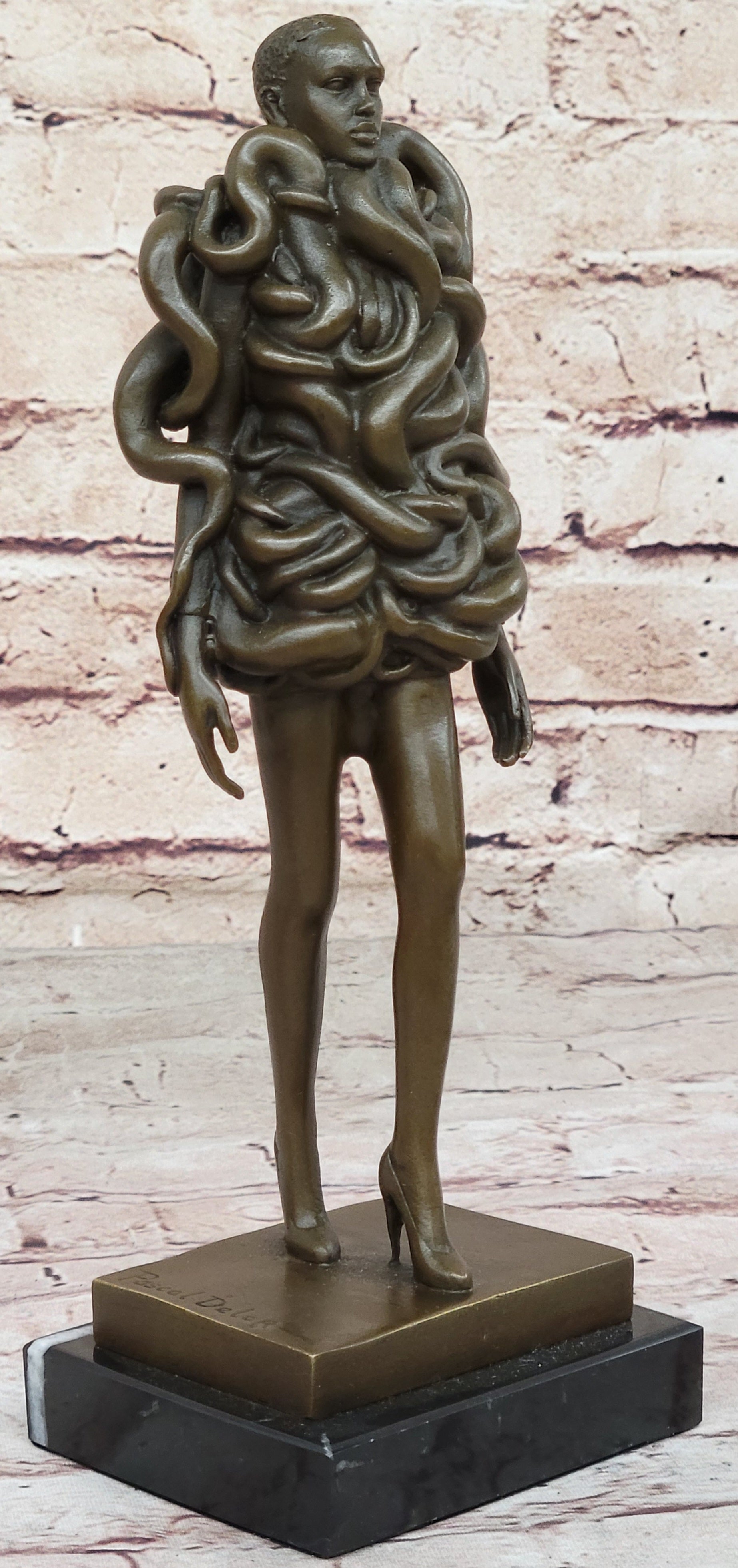 Bronze Sculpture of Woman Wearing Snakes - Unwavering by Pascal Delor