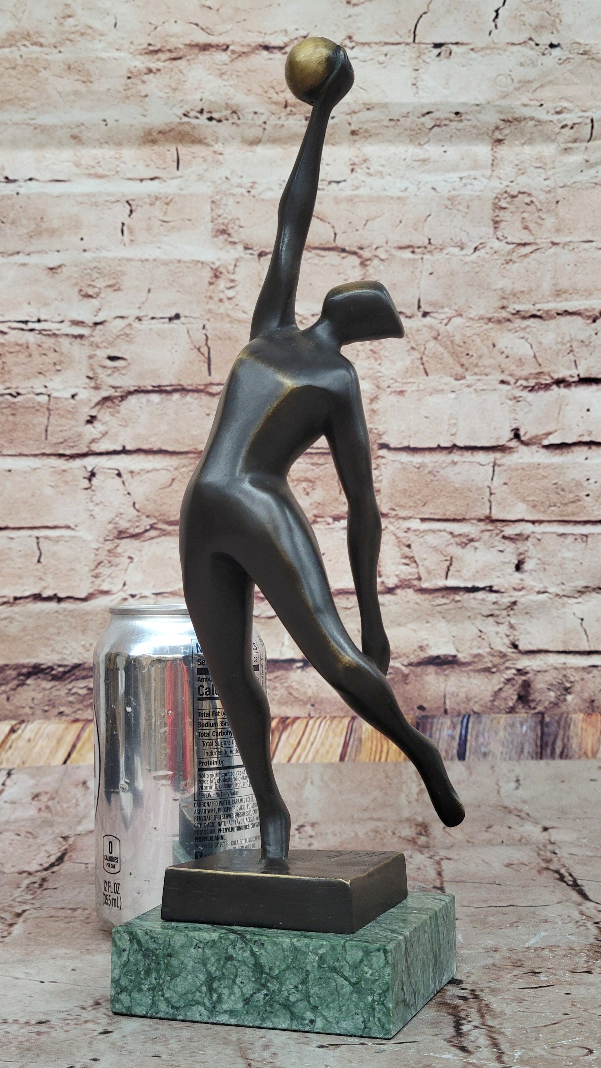 Abstract Bronze Volleyball Athlete with Ball on Marble Base