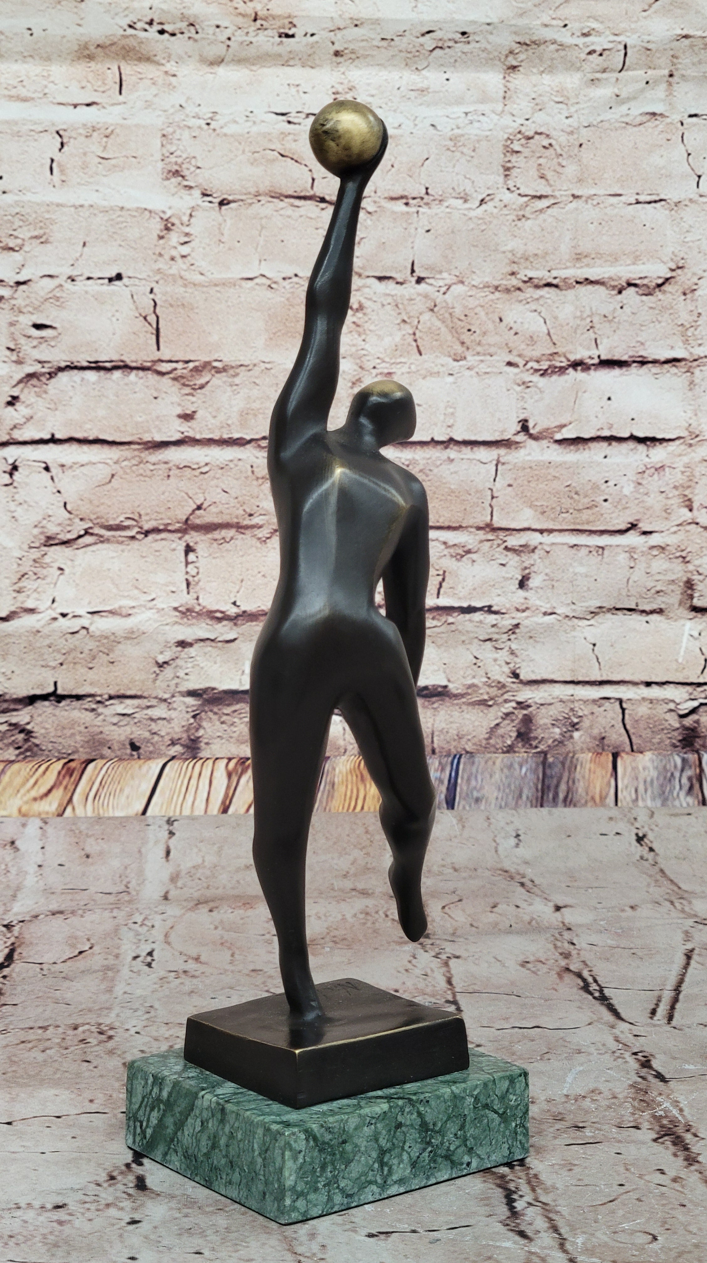 Abstract Bronze Volleyball Athlete with Ball on Marble Base
