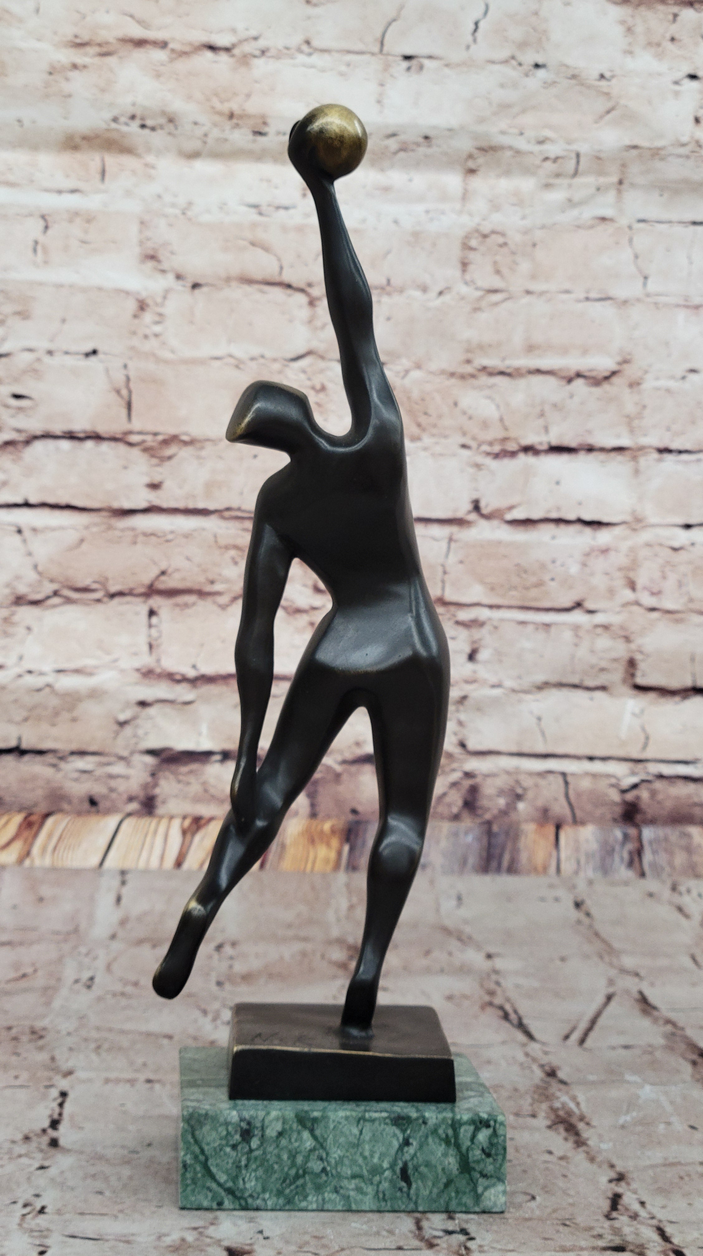 Abstract Bronze Volleyball Athlete with Ball on Marble Base