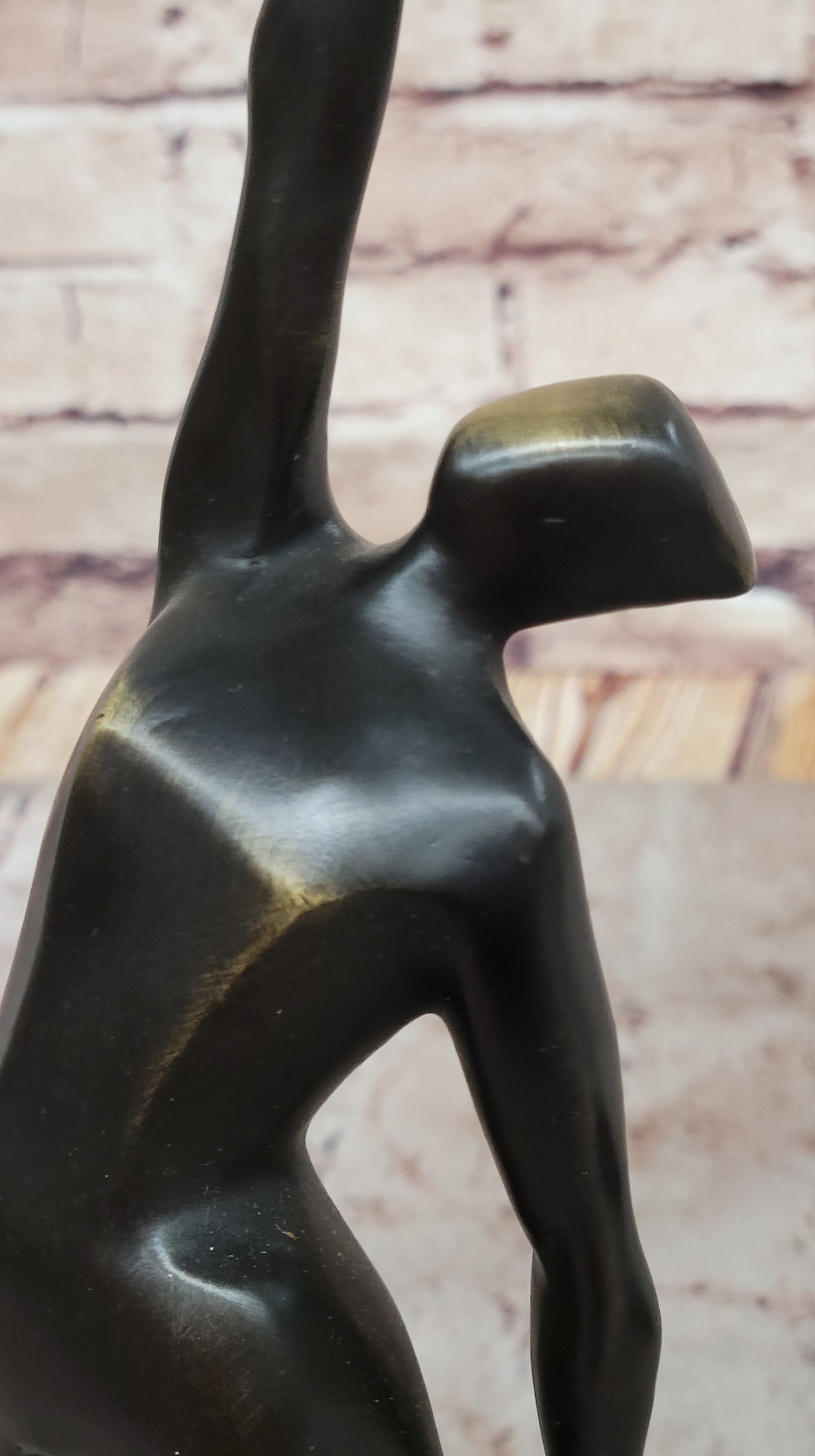 Abstract Bronze Volleyball Athlete with Ball on Marble Base