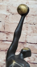 Abstract Bronze Volleyball Athlete with Ball on Marble Base