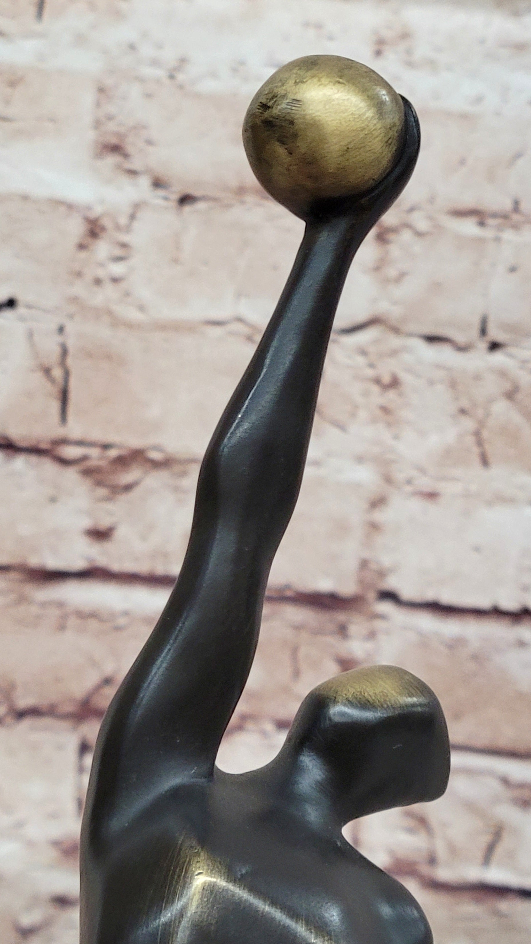 Abstract Bronze Volleyball Athlete with Ball on Marble Base