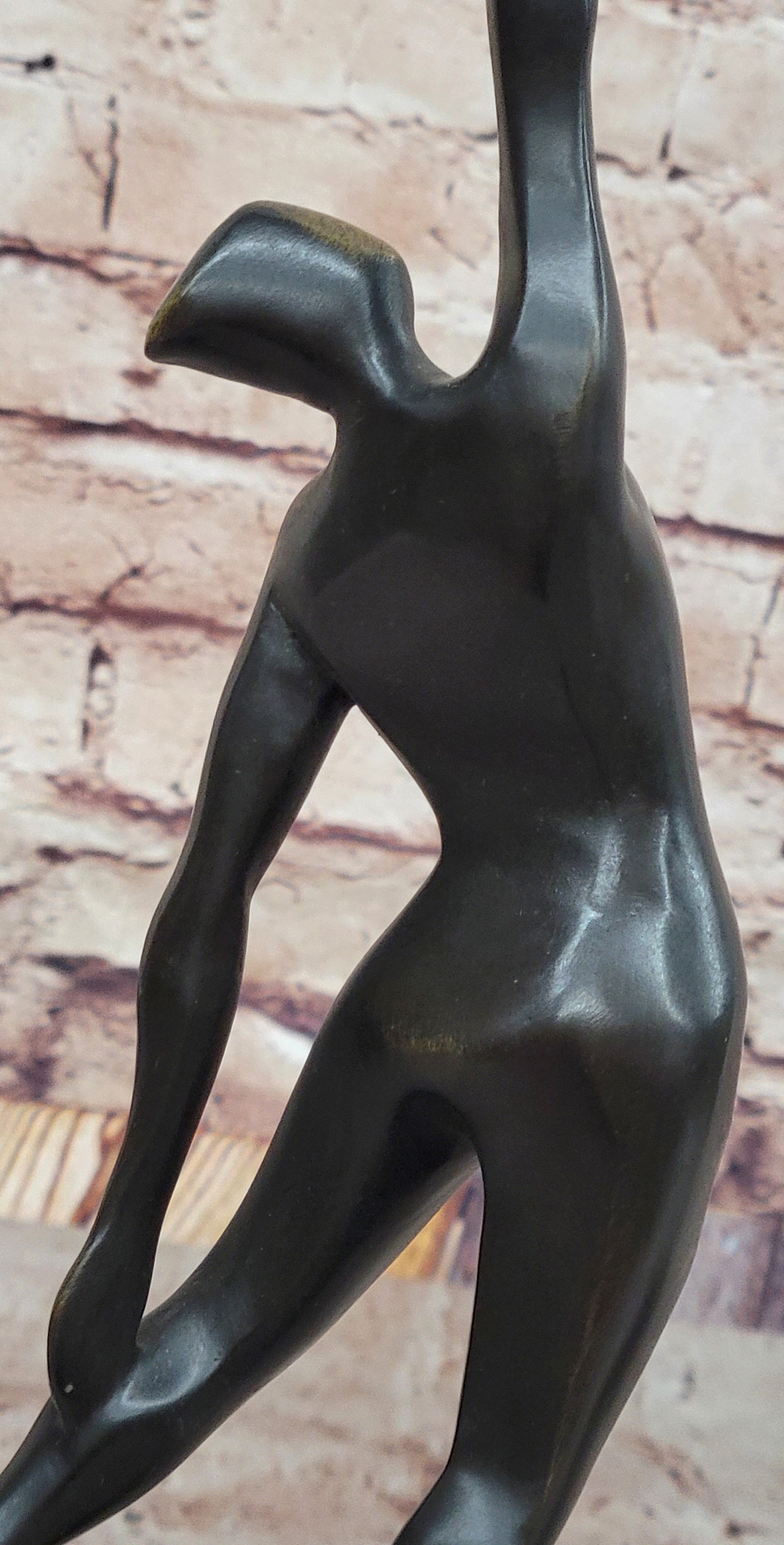 Abstract Bronze Volleyball Athlete with Ball on Marble Base