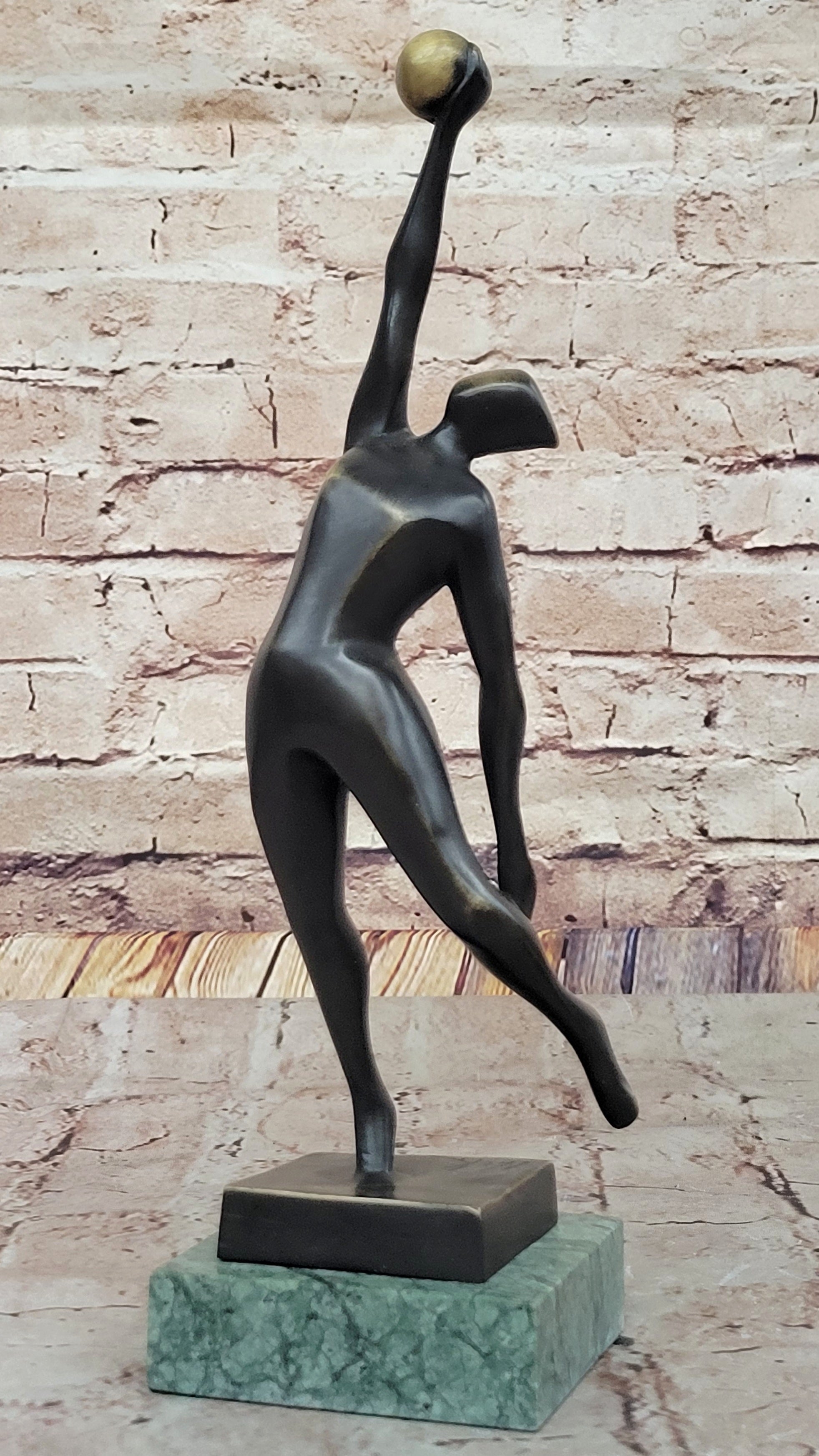 Abstract Bronze Volleyball Athlete with Ball on Marble Base