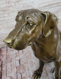 Lifelike Bronze Dog – Realistic Sitting Dog Sculpture