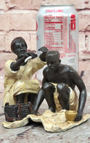 A Franz Bergman cold painted bronze figural group of an Arab barber at work