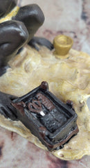 A Franz Bergman cold painted bronze figural group of an Arab barber at work