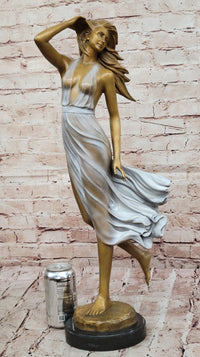 Graceful Bronze Woman in Flowing Dress – Wind Blown