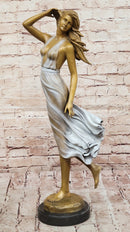 Graceful Bronze Woman in Flowing Dress – Wind Blown