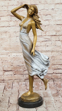 Graceful Bronze Woman in Flowing Dress – Wind Blown