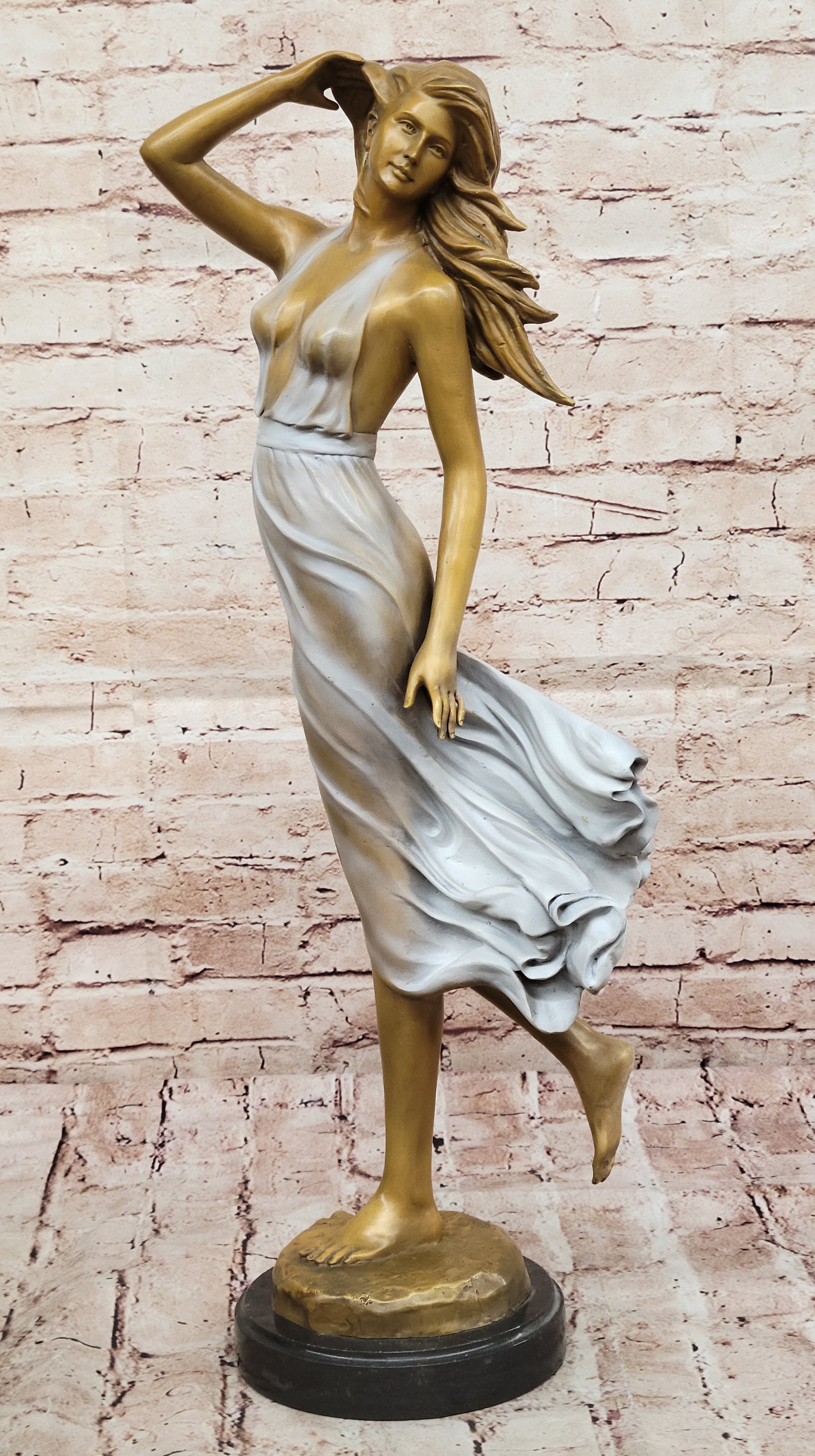 Graceful Bronze Woman in Flowing Dress – Wind Blown