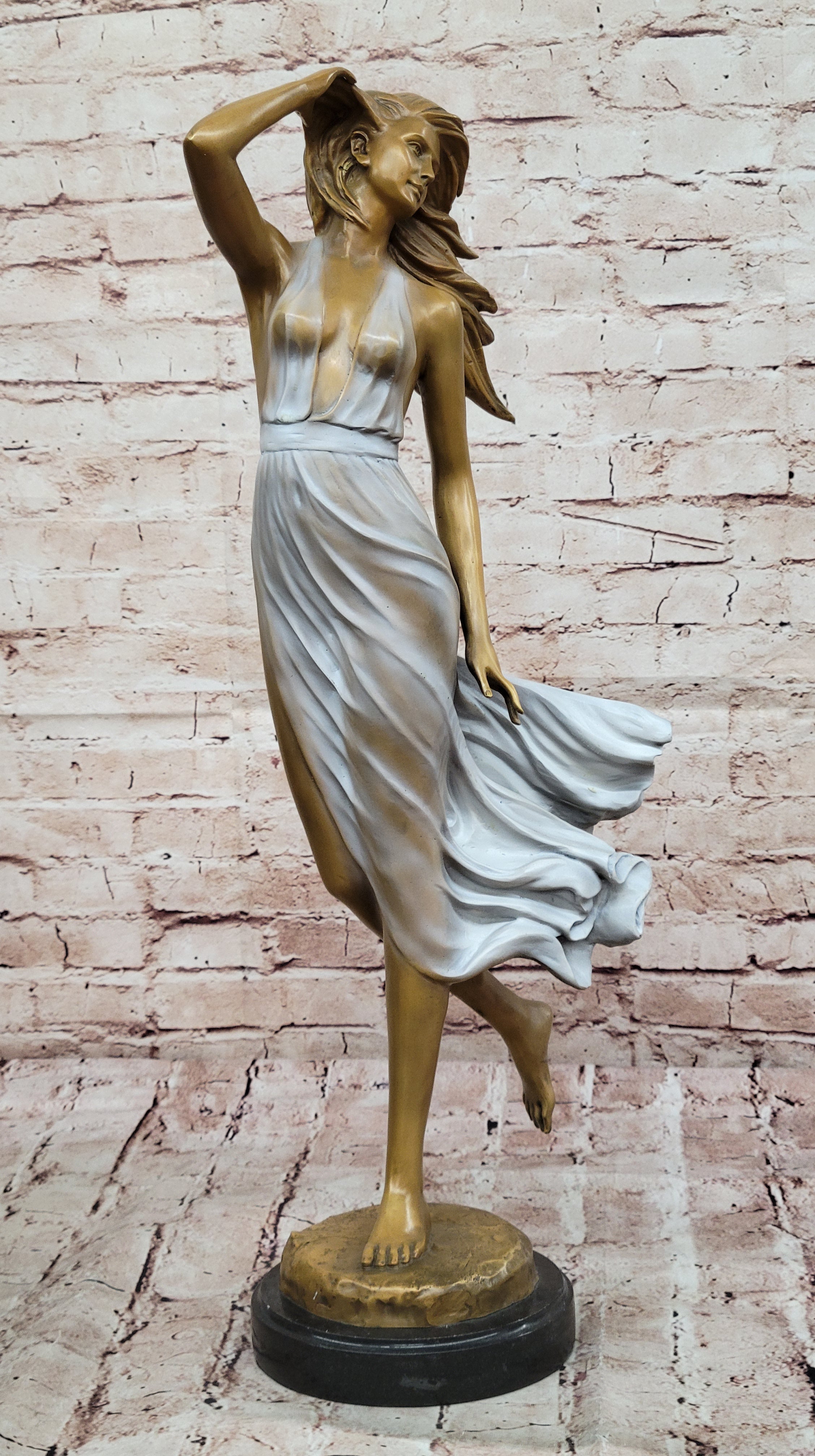 Graceful Bronze Woman in Flowing Dress – Wind Blown