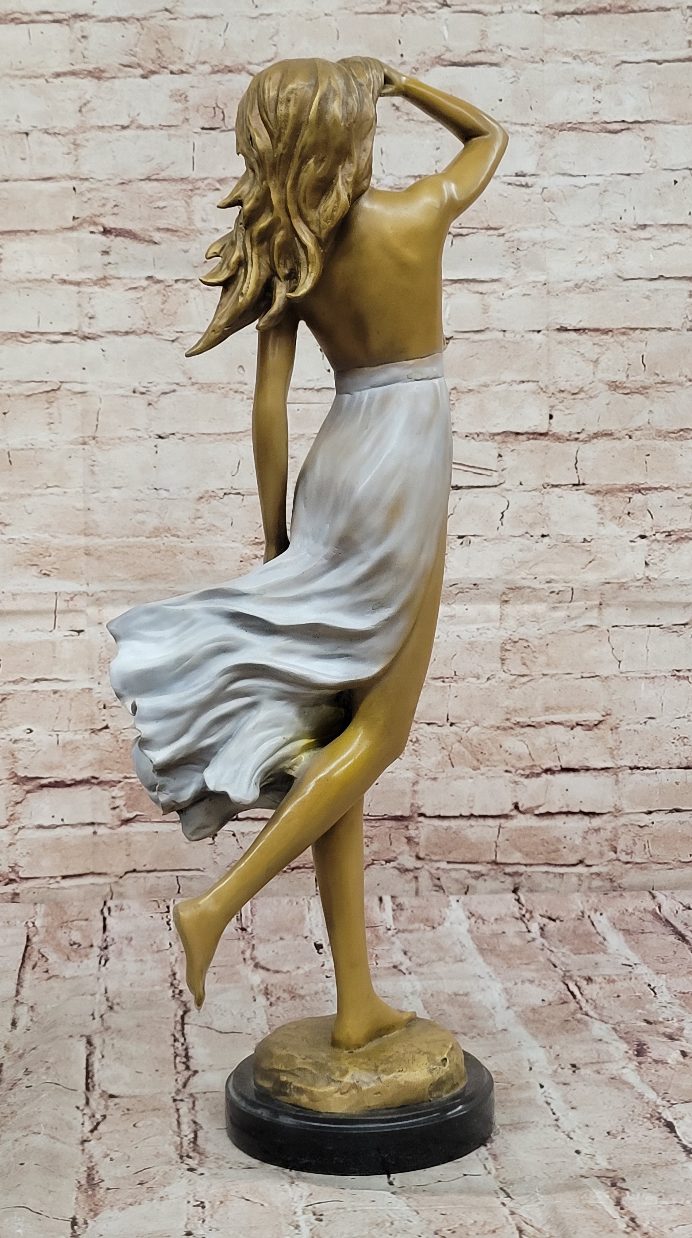 Graceful Bronze Woman in Flowing Dress – Wind Blown