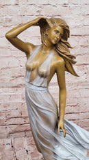 Graceful Bronze Woman in Flowing Dress – Wind Blown