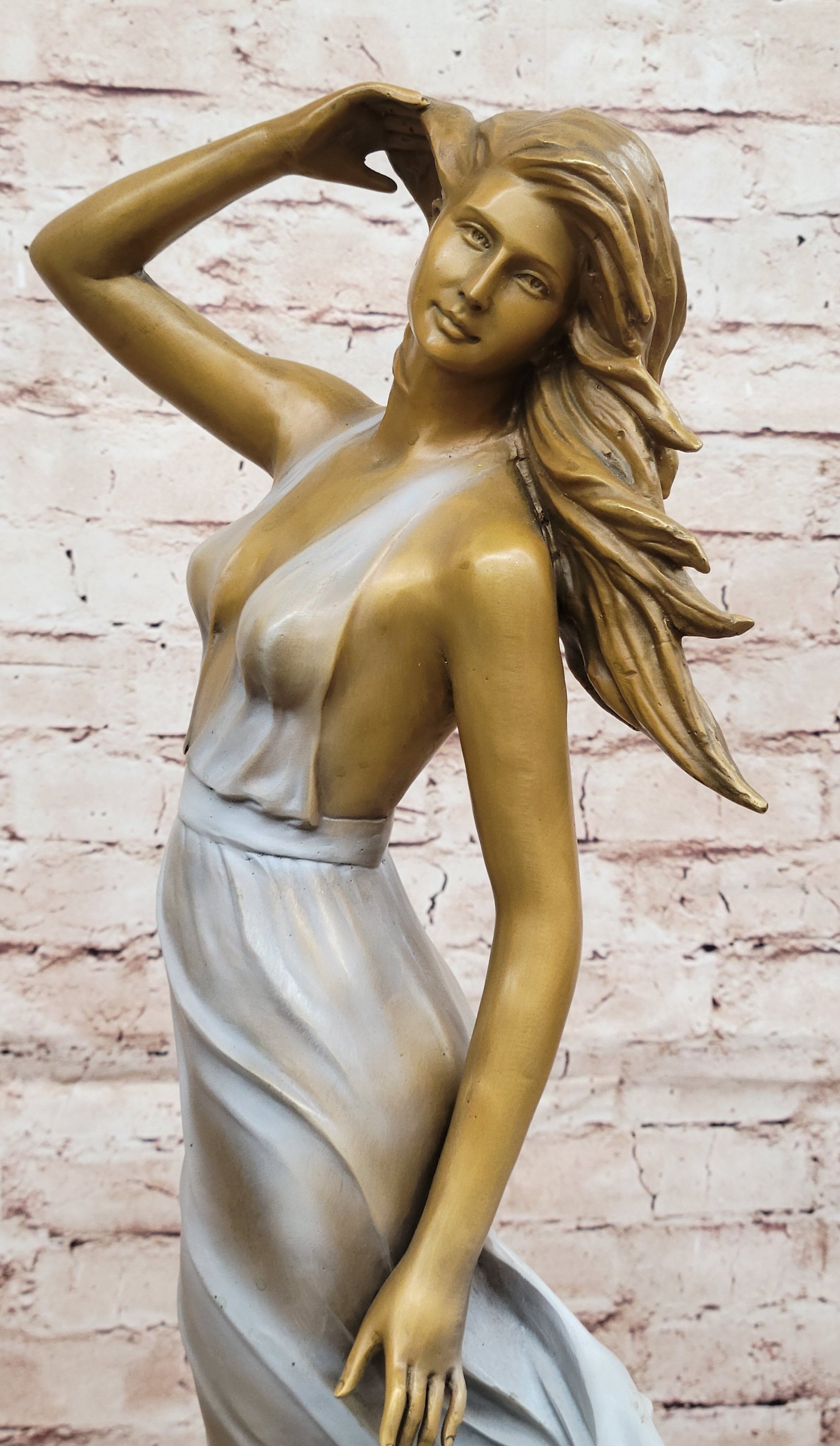 Graceful Bronze Woman in Flowing Dress – Wind Blown