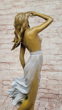 Graceful Bronze Woman in Flowing Dress – Wind Blown