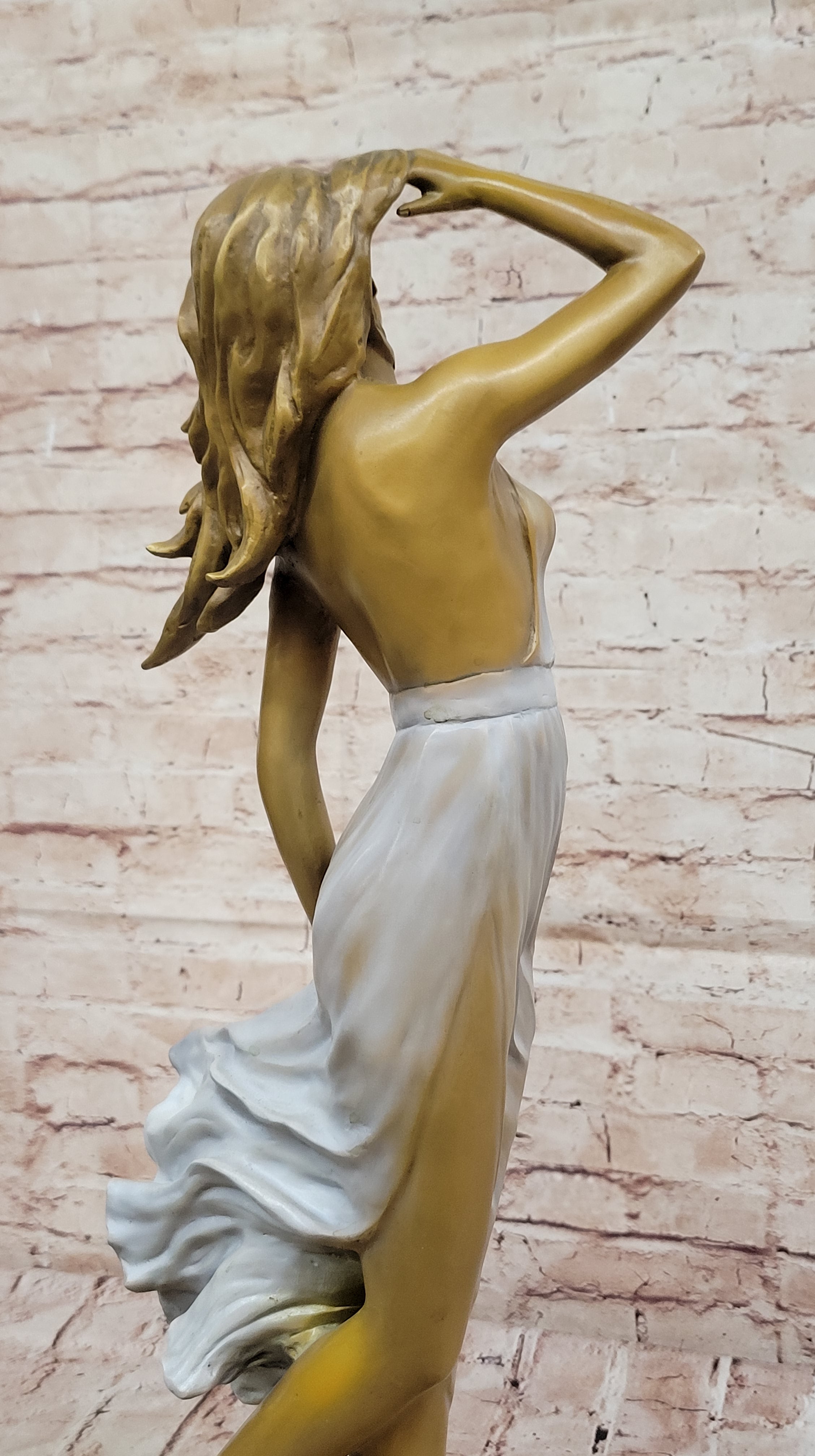 Graceful Bronze Woman in Flowing Dress – Wind Blown