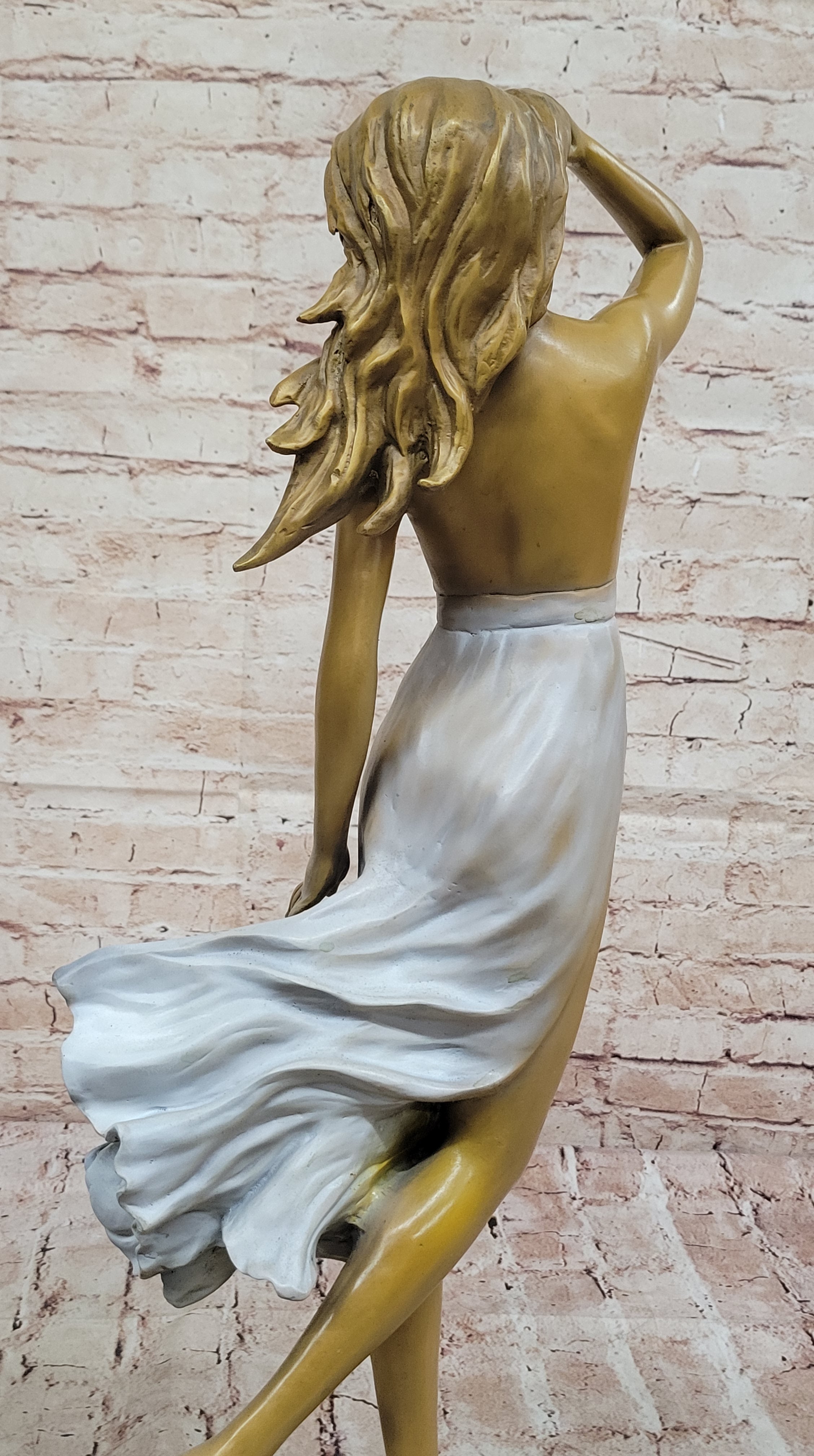 Graceful Bronze Woman in Flowing Dress – Wind Blown