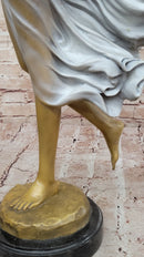 Graceful Bronze Woman in Flowing Dress – Wind Blown