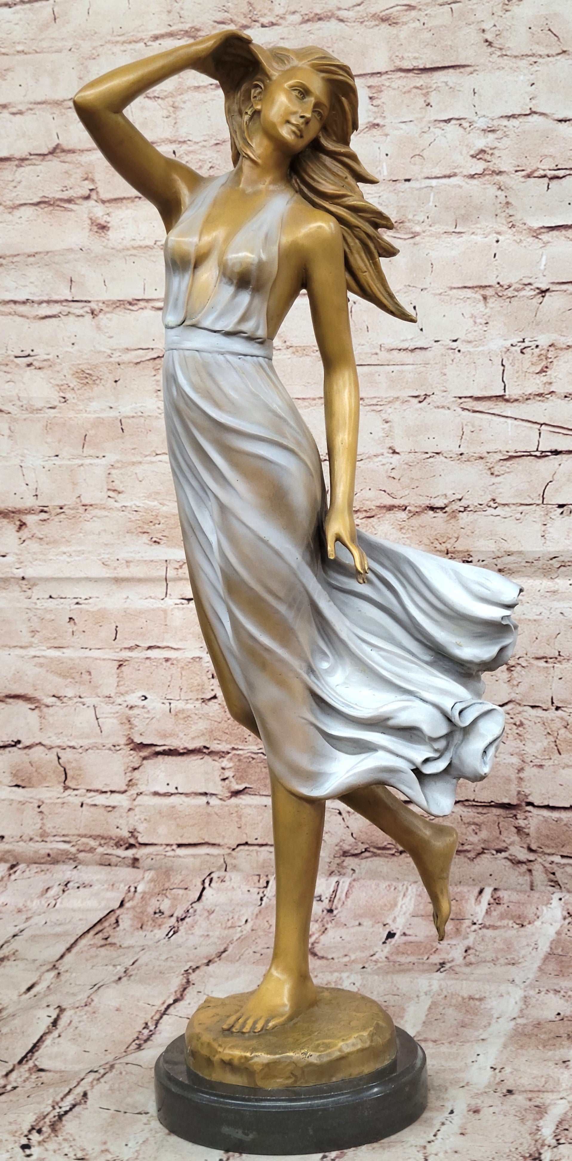 Graceful Bronze Woman in Flowing Dress – Wind Blown