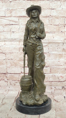 Western Bronze Cowgirl Sculpture with Rifle and Cowboy Hat