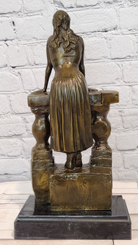 Bronze Sculpture Depicts a Woman Leaning Against a Balustrade Signed Milo Statue