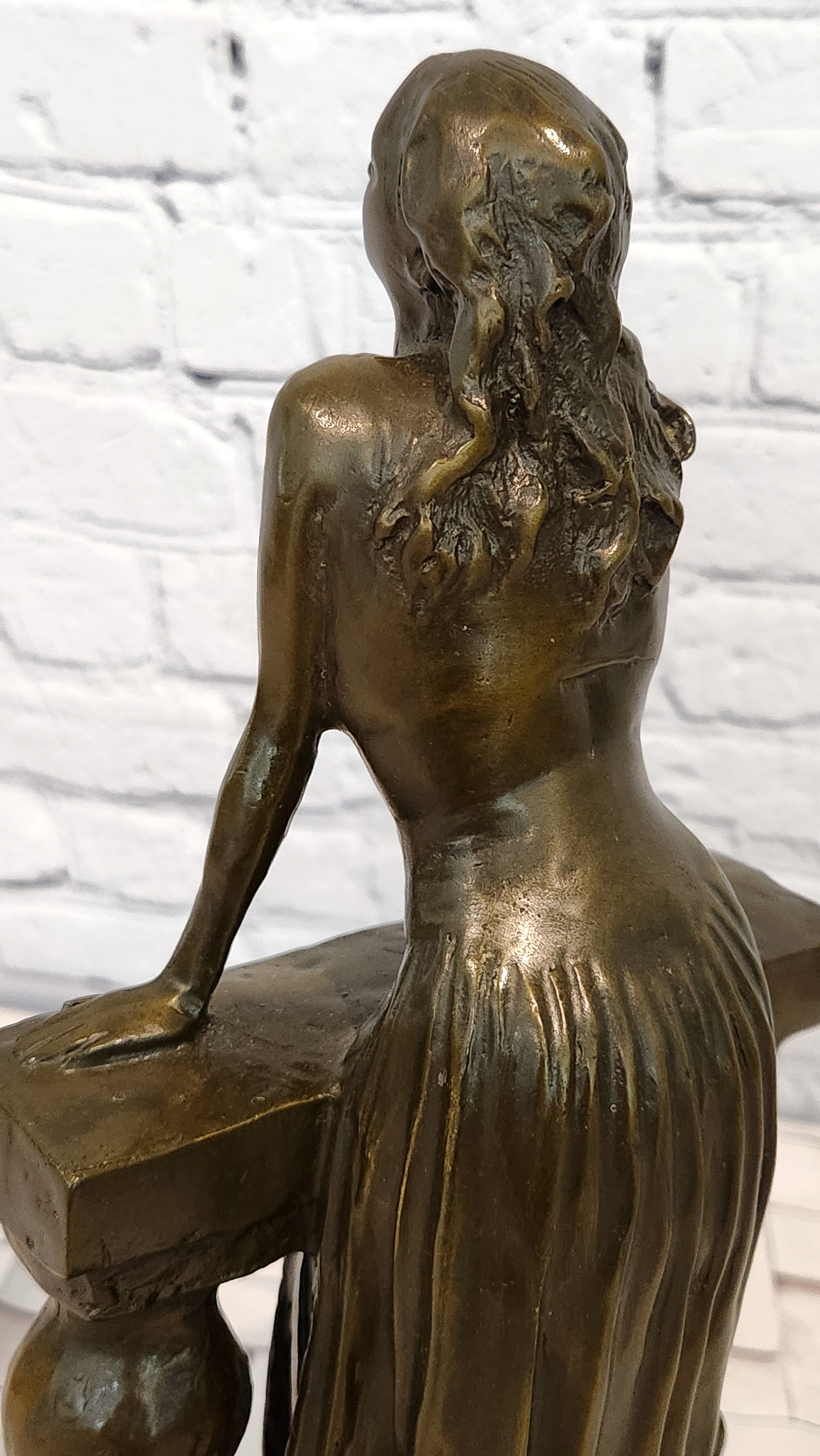 Bronze Sculpture Depicts a Woman Leaning Against a Balustrade Signed Milo Statue