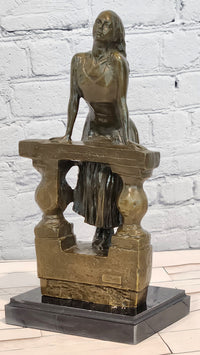 Bronze Sculpture Depicts a Woman Leaning Against a Balustrade Signed Milo Statue