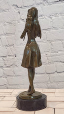 Hand Made Bronze Sculpture of a Young Girl playing the Flute by J. Patoue