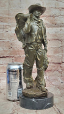 Cowboy with Saddle Bronze Sculpture - Western Art