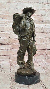 Cowboy with Saddle Bronze Sculpture - Western Art