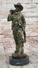 Cowboy with Saddle Bronze Sculpture - Western Art