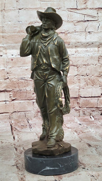 Cowboy with Saddle Bronze Sculpture - Western Art
