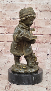 Winter Child Reading Book – Bronze with Teddy Bear
