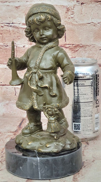 Bronze Winter Child Sculpture – Girl with Horn and Doll