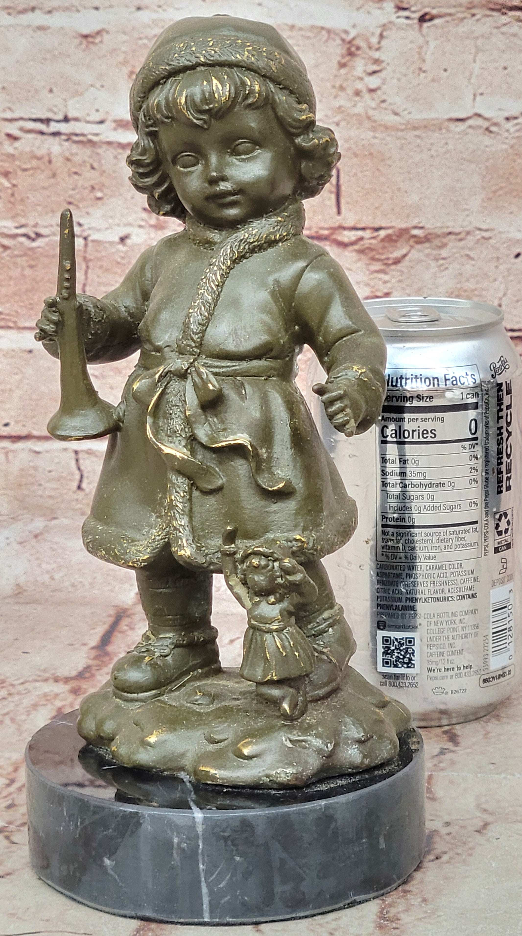 Bronze Winter Child Sculpture – Girl with Horn and Doll