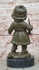 Bronze Winter Child Sculpture – Girl with Horn and Doll