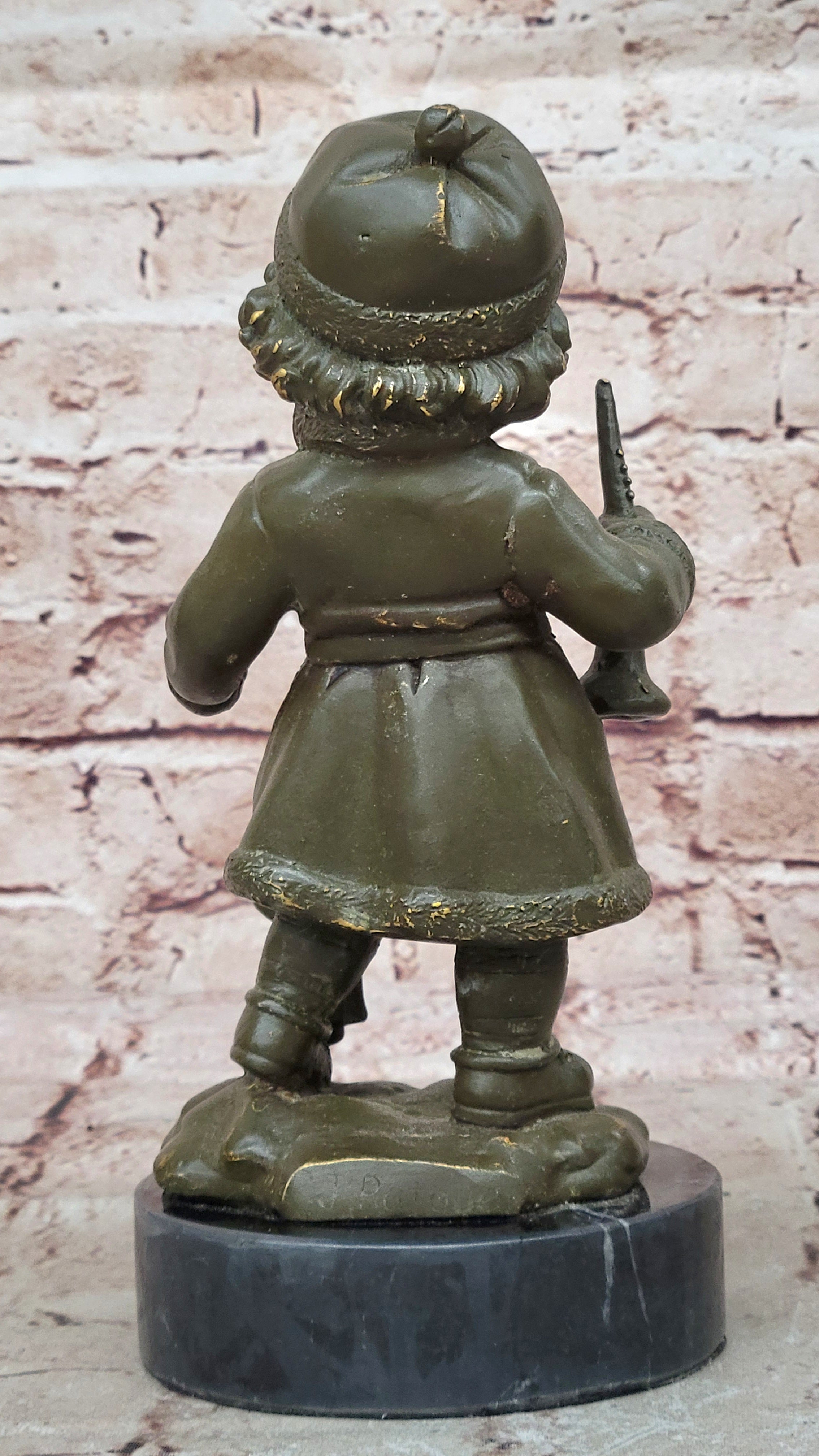 Bronze Winter Child Sculpture – Girl with Horn and Doll