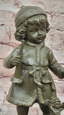 Bronze Winter Child Sculpture – Girl with Horn and Doll