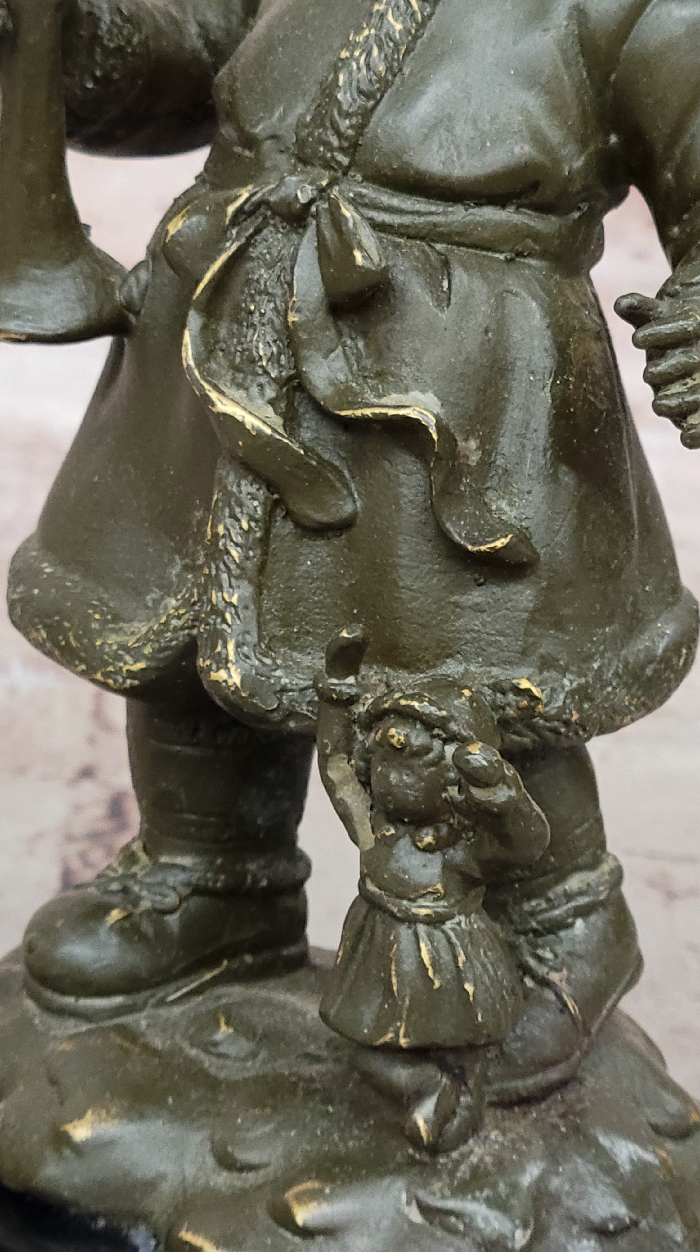 Bronze Winter Child Sculpture – Girl with Horn and Doll