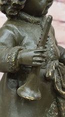Bronze Winter Child Sculpture – Girl with Horn and Doll