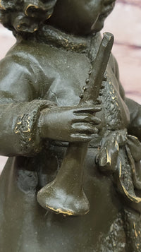 Bronze Winter Child Sculpture – Girl with Horn and Doll