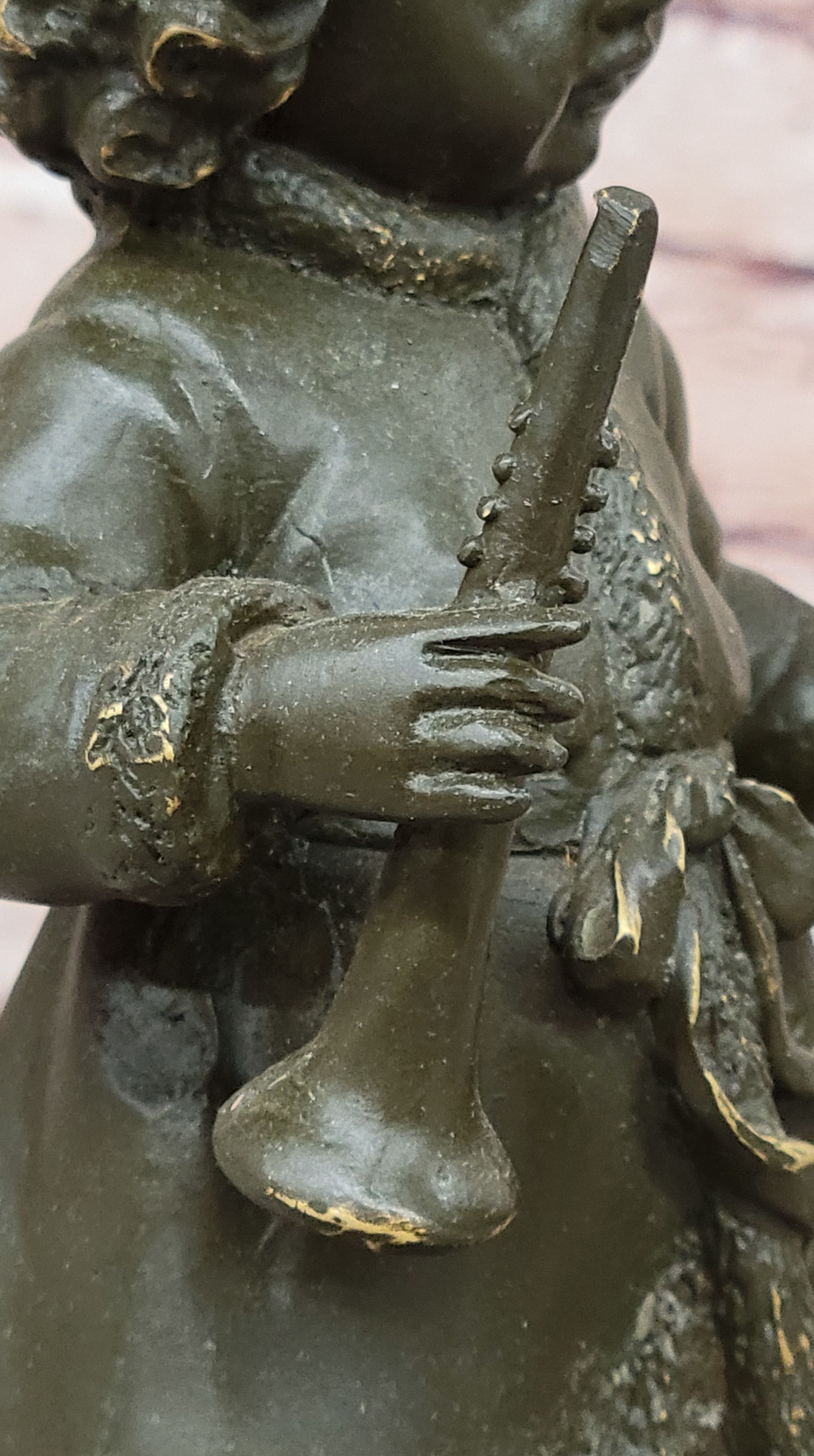 Bronze Winter Child Sculpture – Girl with Horn and Doll