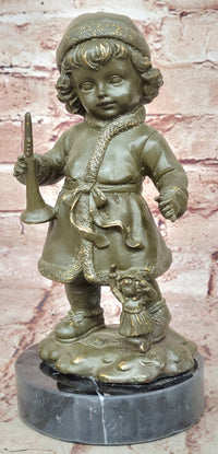 Bronze Winter Child Sculpture – Girl with Horn and Doll