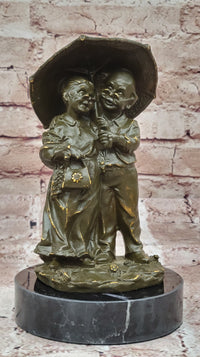 Bronze Elderly Couple Sculpture – Holding Umbrella