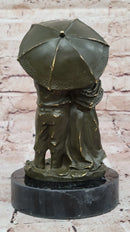 Bronze Elderly Couple Sculpture – Holding Umbrella