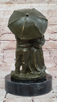 Bronze Elderly Couple Sculpture – Holding Umbrella
